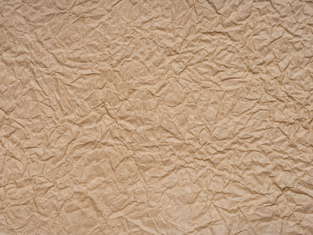 Beige crumpled paper texture. Blank soft page pattern for winter season festival card.の写真素材