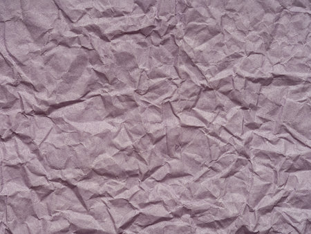A lavender crumpled paper with textured surface, the texture whispers of softness and quiet morning lightの写真素材