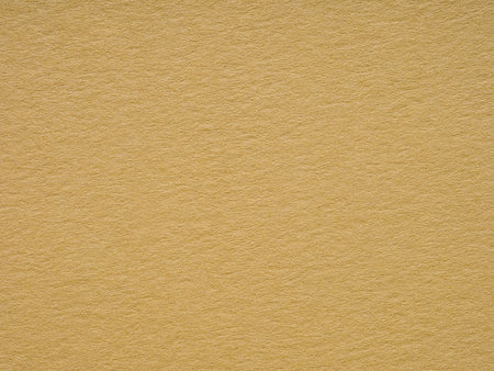 A vivid yellow backdrop highlights the intricate texture and delicate fibers woven through this premium paper surfaceの写真素材