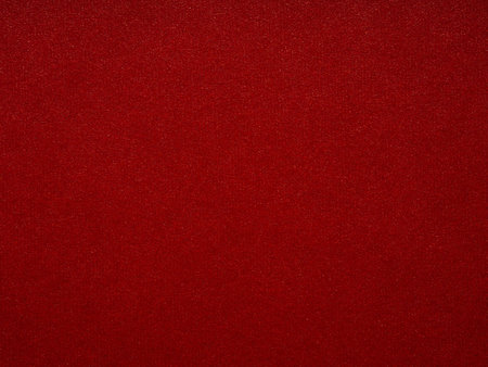 A rich tapestry of ruby red, the textured surface pulsates with vibrancy and the promise of stories untoldの写真素材