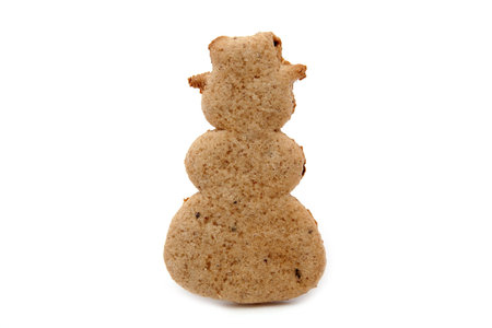 snowman shaped gingerbread cookie on whiteの写真素材