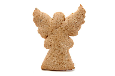 angel shaped gingerbread cookie on whiteの写真素材