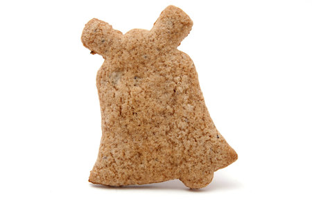 bell shaped gingerbread cookie on whiteの写真素材
