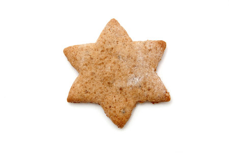 star shaped gingerbread cookie on whiteの写真素材