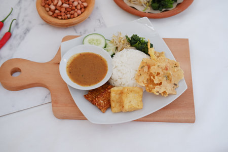 Thai food with rice and shrimp paste on wooden board in restaurantの写真素材