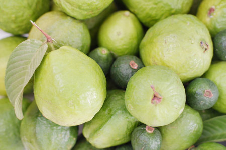 Fresh guava fruit on the market, closeup of photo.の写真素材