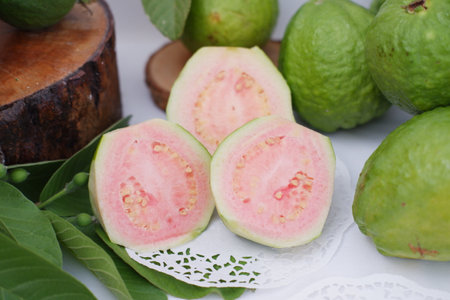 Fresh guava fruit on white background, green guava fruits with leaves.