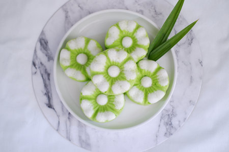 Kue Putu Ayu, a traditional Indonesian snack made from rice flour, pandan leaves, grated coconut...