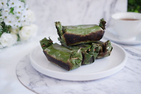 Lemper Bakar. Lemper is a traditional Indonesian snack made of glutinous rice and filled with...