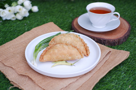 Curry puff or Pastel Goreng is Pastry Popular in Indonesia. fried pastry with filling of sauted...