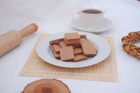 photo delicious wafers and a cup of coffee for breakfast, top viewの写真素材