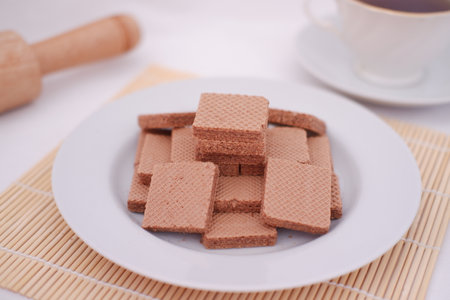 photo delicious wafers and a cup of coffee for breakfast, top viewの写真素材