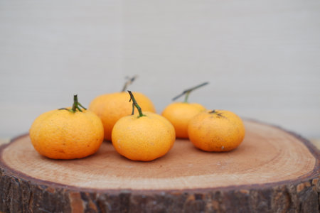 Fresh tangerines on a wooden background. Selective focus.の写真素材