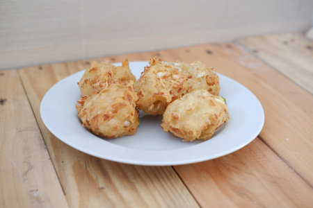 Bakwan sayur or vegetable fritter, Indonesian snack made from flour, cabbage, carrots and bean...