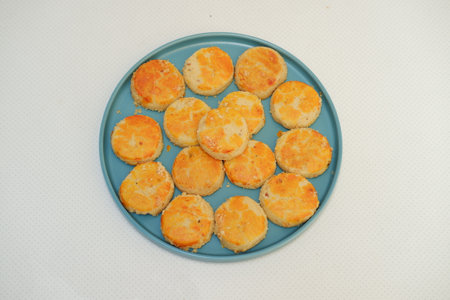 peanut cookies on a blue plate on a white tablecloth.