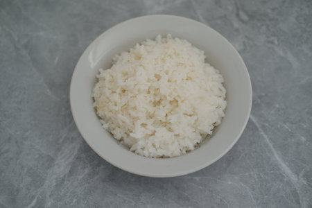 Cooked rice in a bowl background, top view.の写真素材
