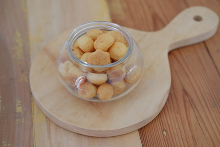a traditional cake from Indonesia called kue sus filled with cream puffs. served on jarの写真素材