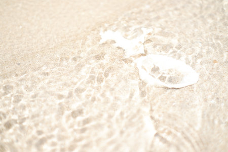 White sand and sea water on the beach. Selective focus.の写真素材