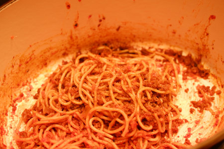Spaghetti bolognese on a saucepan in a restaurantの写真素材