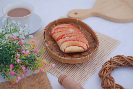 Strawberry bread with chocolate drink on white background