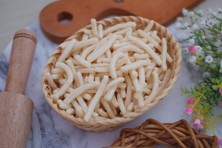 delicious onion flavored snack in rattan basketの写真素材
