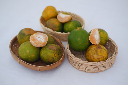Orange fruit in basket. Selective focus and shallow depth of field.の写真素材