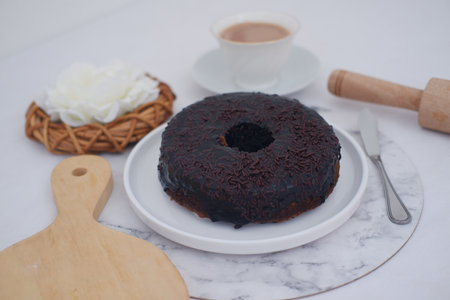 Chocolate cake on plate with white backgroundの写真素材