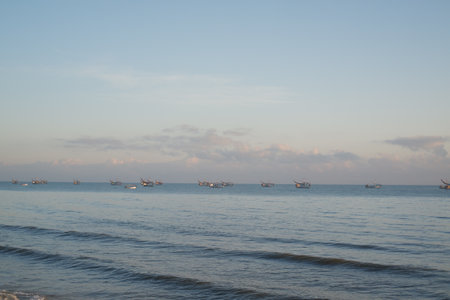 Serene Sunrise Over the Calm Beachの写真素材