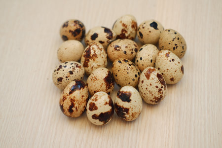 Quail eggs on a wooden table. Close-up, selective focusの写真素材