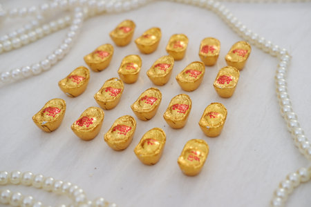 gold chocolate on a white background.の写真素材