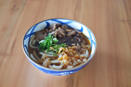 Rice noodle with beef in bowl on wooden table background.の写真素材