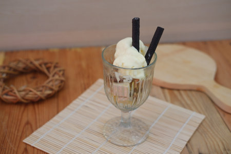 Glass filled with ice cream and waferの写真素材