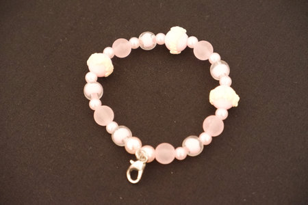 A beaded bracelet on a black surface.の写真素材