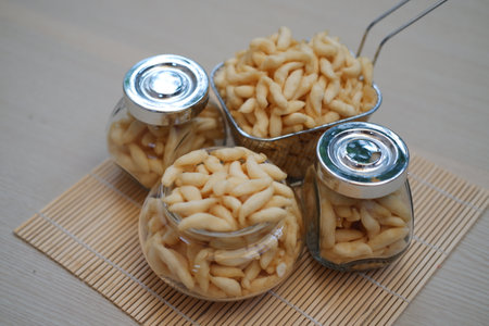 telur gabus sticks in a jar on wooden tableの写真素材