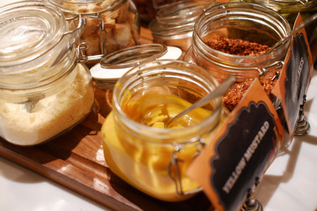 pickles in a jar on a white table, close-upの写真素材