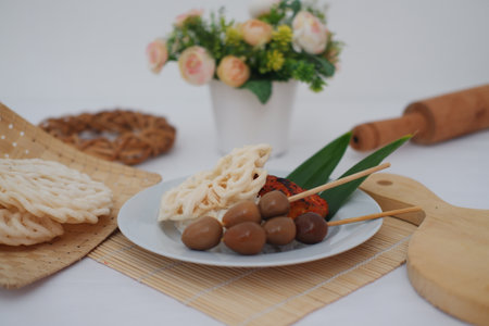 rice with skewered quail eggs and crackers on bamboo mat. Selective focus.の写真素材