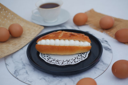 Eclair on a plate with beautiful decorationの写真素材
