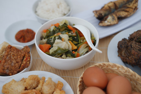traditional Indonesian food arranged neatly on a table surfaceの写真素材
