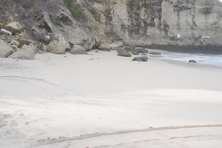 Serene Beach with Stunning Rock Formationsの写真素材