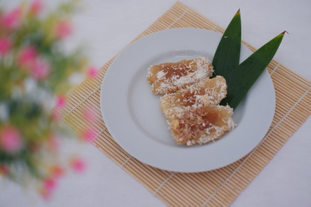 a traditional Southeast Asian dessert beautifully served on a white plateの写真素材