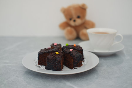 several pieces of moist chocolate cake served on a white plateの写真素材