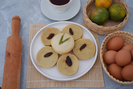 displays a plate of traditional Indonesian snacks known as kue lumpurの写真素材