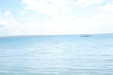 a serene seascape under a partly cloudy skyの写真素材