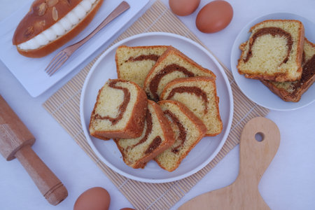 a delightful display of marble cake slices arranged neatly on a white plateの写真素材