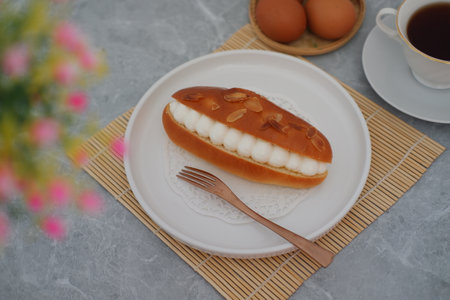 The bun is topped with toasted almond slicesの写真素材