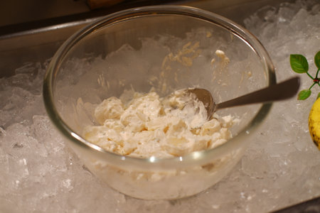 Potato Salad in a Glass Bowl on Iceの写真素材
