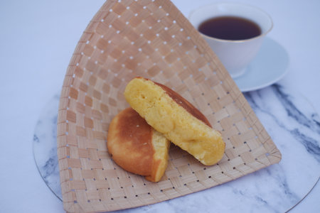These cakes are golden-brown with a fluffy interior, known for their sweet, slightly vanilla flavorの写真素材