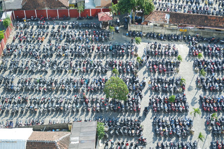 an aerial view of a large, densely packed motorcycle parking lotの写真素材
