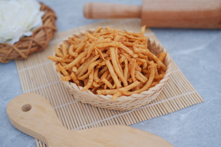 Crispy Fried Snacks in a Wicker Basketの写真素材