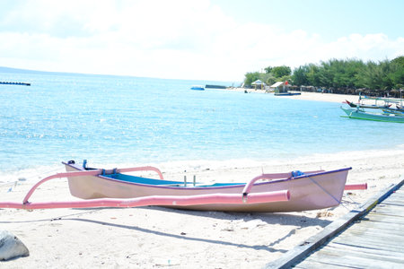 Serene Beach Scene A Boat Resting on the Shoreの写真素材